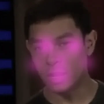 The same face with a pink glow over the eyes, mouth and cheeks.